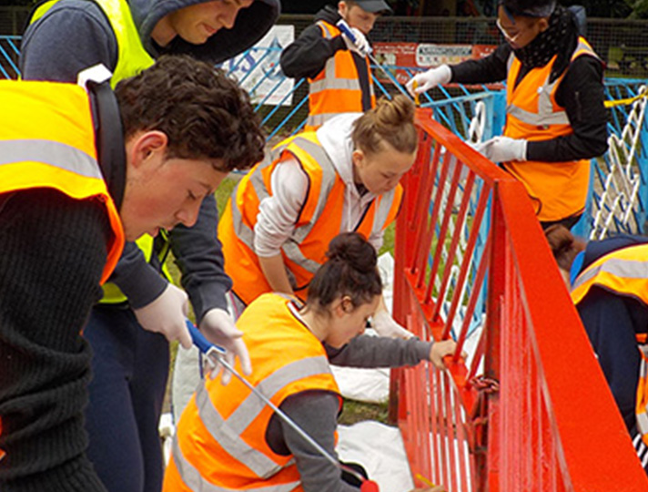 Students painting a playground