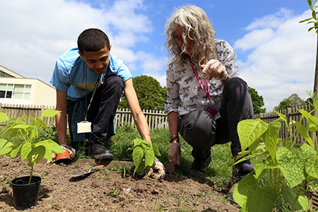 Student in the garden at Bromley Campus